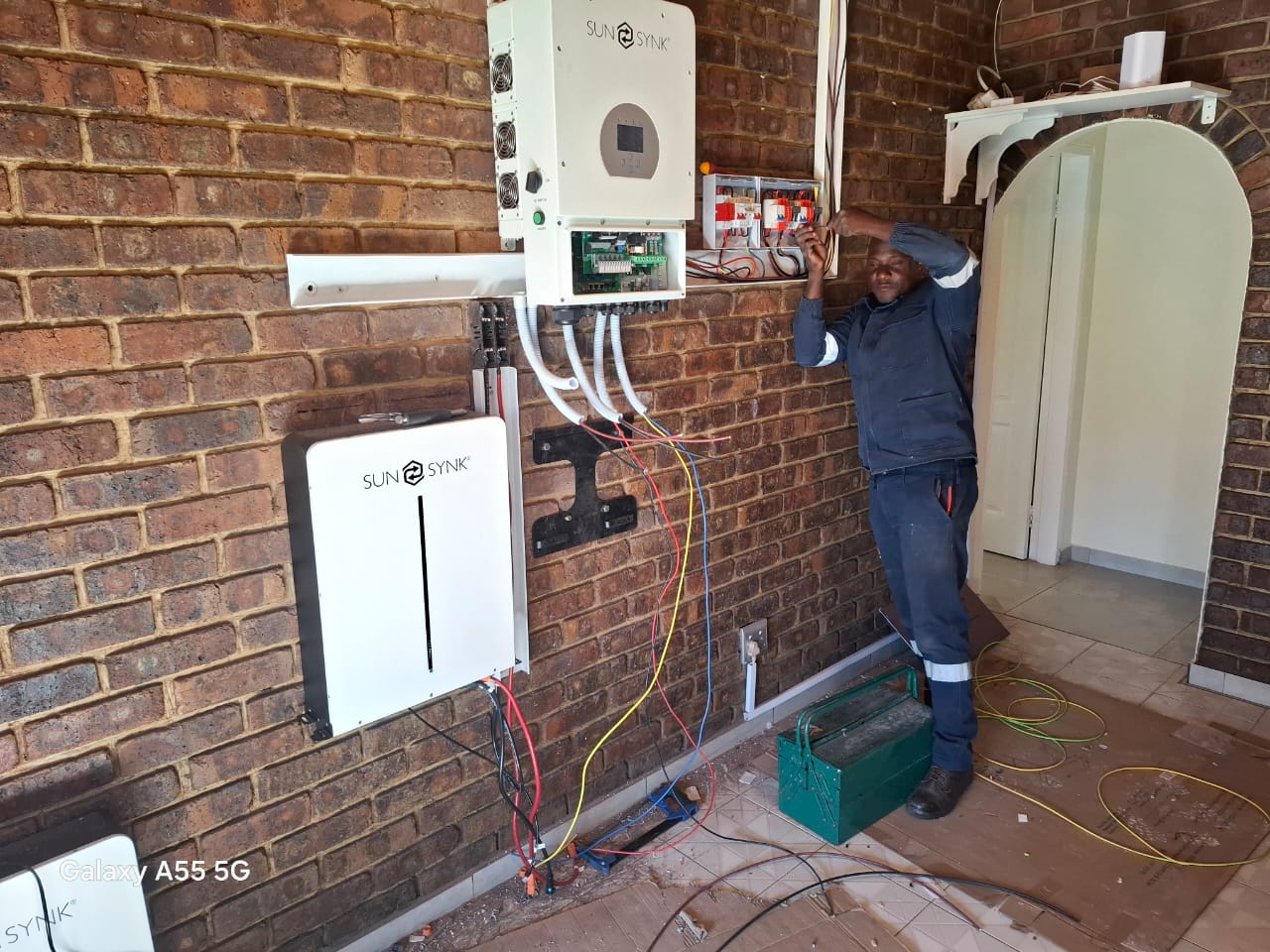 Wall-mounted inverter and battery backup installation