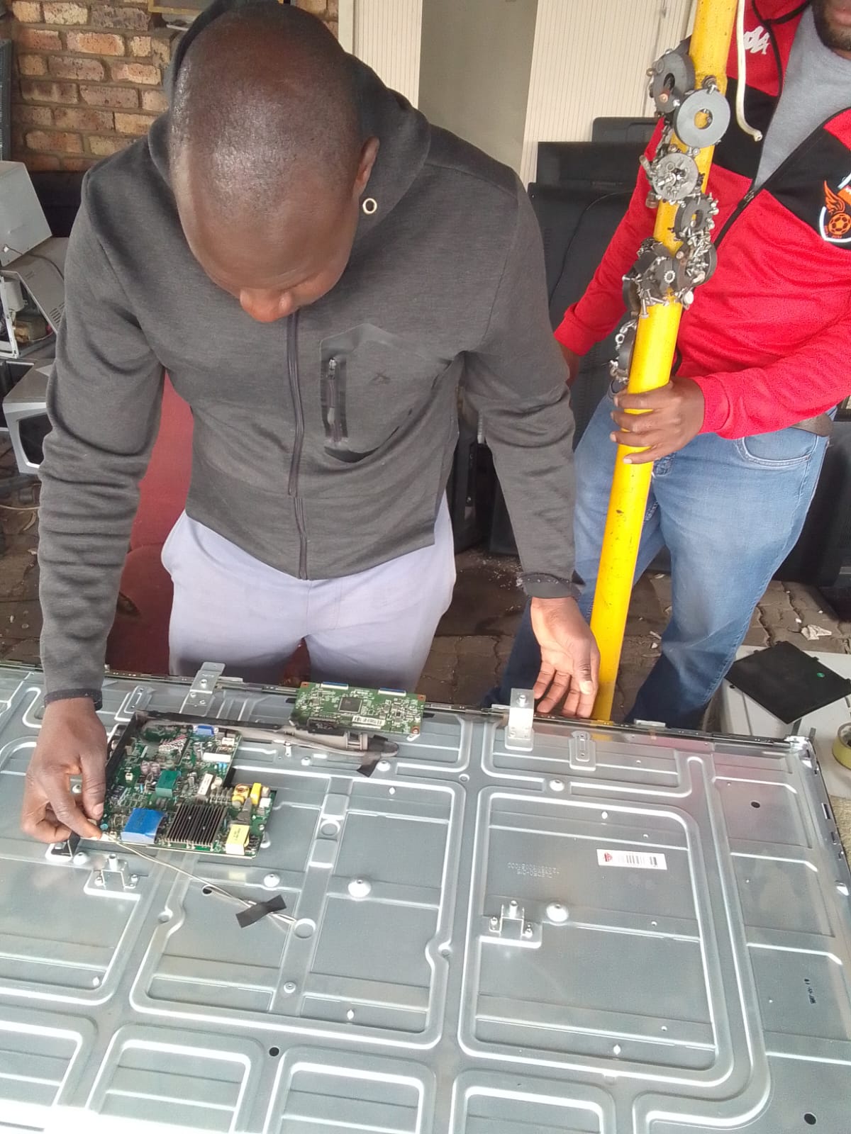 Appliance or equipment repair work with exposed internal components