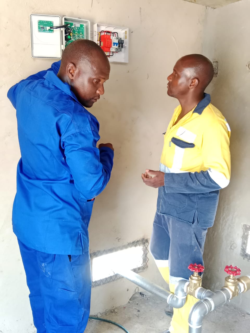 TATT technician discussing site requirements with a client